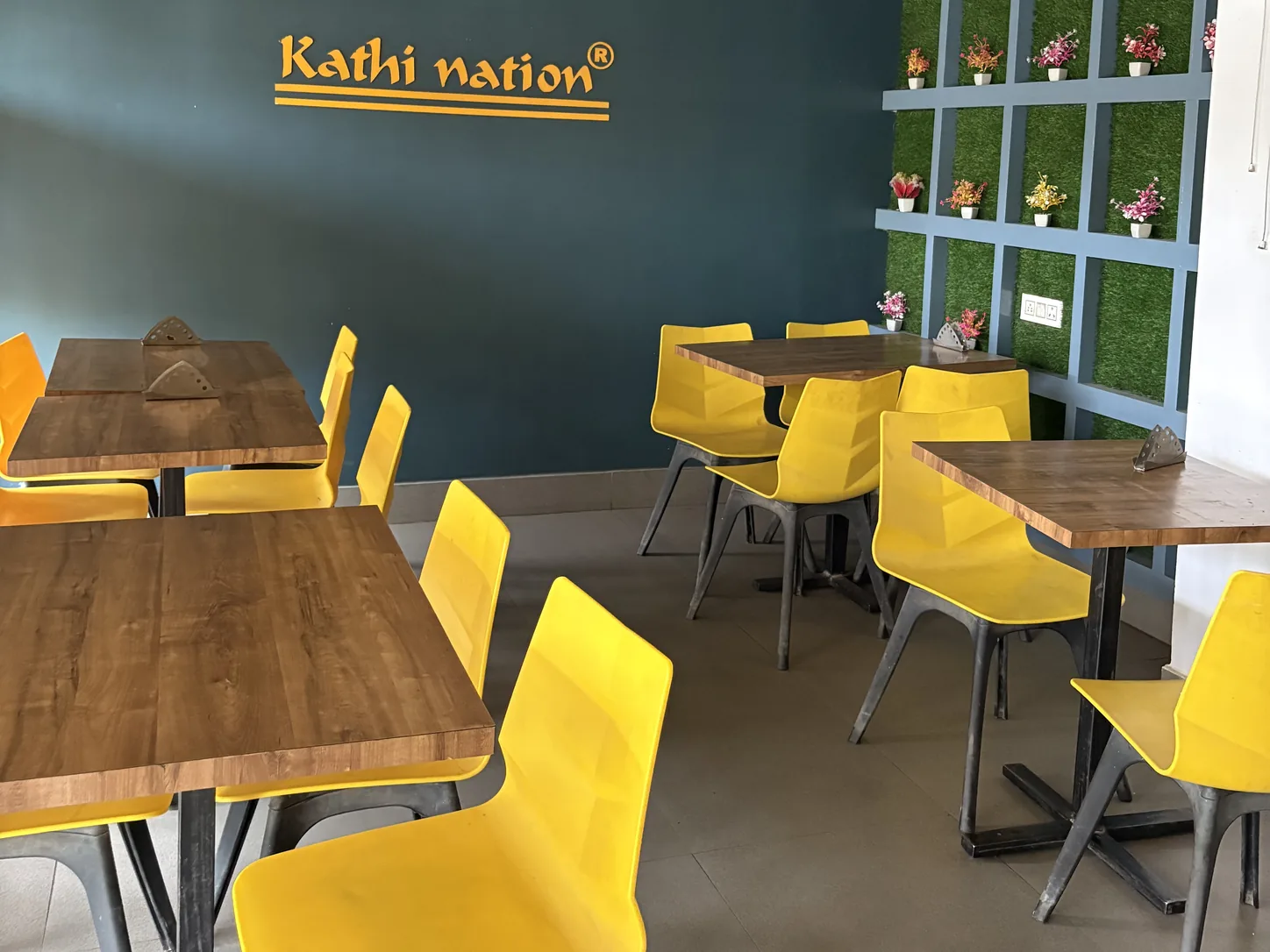 Wooden tables and chairs in the in-house dining area