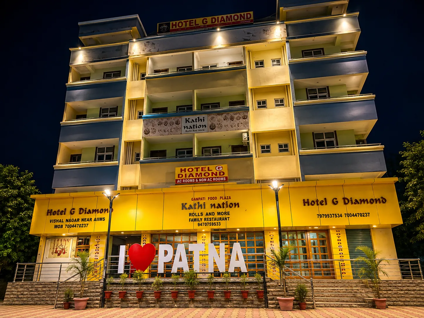 Hotel G Diamond lit up at night, seen from the street near AIIMS Patna
